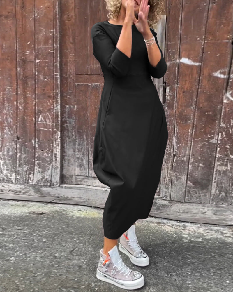 Elegante abito monocromatico con tasche