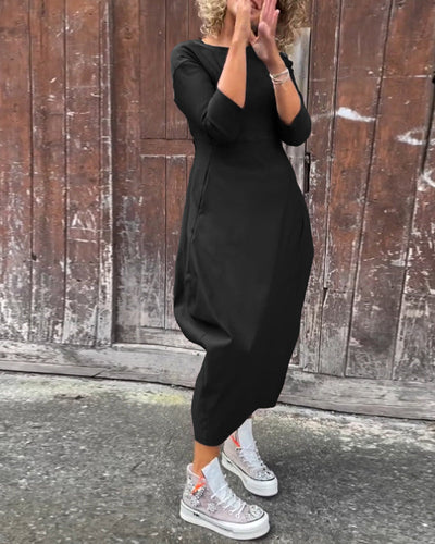 Elegante abito monocromatico con tasche